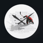 I am a Hockey Player Round Clock<br><div class="desc">Mix up some perseverance,  a lot of determination,  some guts and plenty of sacrifice. Now you've got a hockey player! Another great design for hockey t-shirts and hockey gifts from eBrush Design!</div>