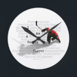I am a Hockey Player Round Clock<br><div class="desc">Mix up some perseverance,  a lot of determination,  some guts and plenty of sacrifice. Now you've got a hockey player! Another great design for hockey t-shirts and hockey gifts from eBrush Design!</div>