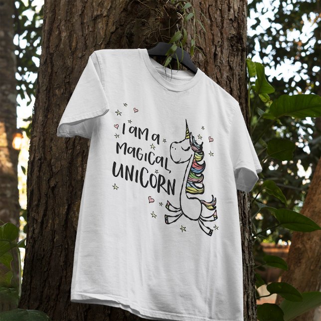 I Am A Magical Unicorn T-Shirt (Featuring a dreamy unicorn flying around stars and hearts spreading joy for all to see. )