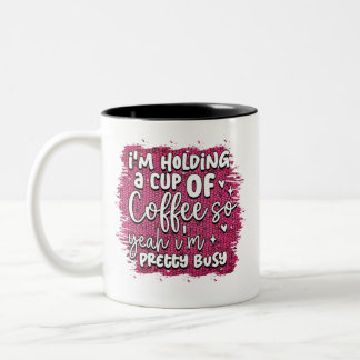 I am holding a cup of coffee 