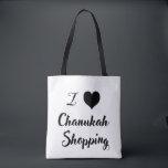 I 🖤 Chanukah. Shopping Tote Bag<br><div class="desc">Bring some fun and whimsy to your holiday errands with our festive I 🖤 Chanukah shopping tote! Featuring a bold typography design with contrasting black and white colouring. this eco-friendly tote is perfect for carrying gifts, groceries, and more while spreading Chanukah joy” Durable, spacious, and stylish, it’s the ultimate holiday...</div>