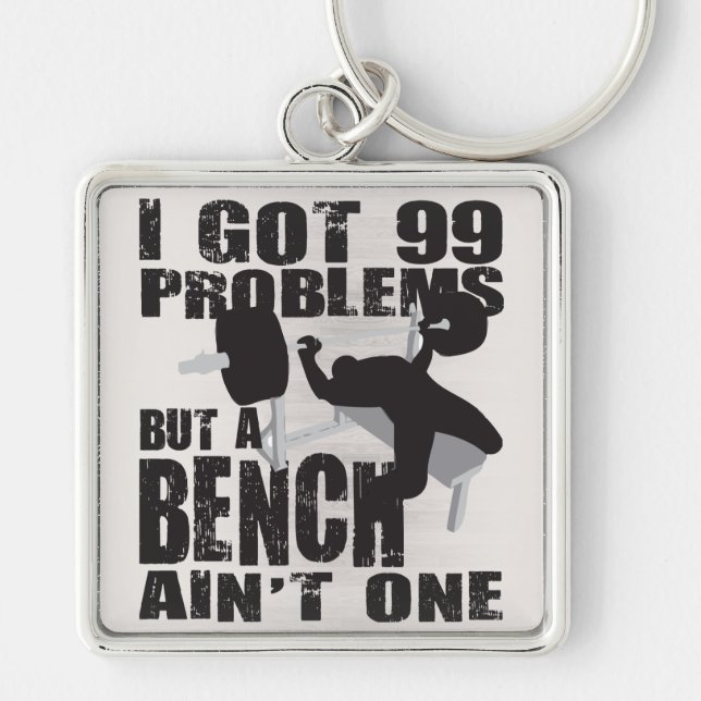 I Got 99 Problems But A Bench Ain't One Keychain (Front)