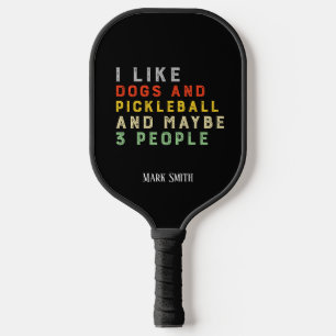 I like dogs and Pickleball and may be 3 people Pickleball Paddle