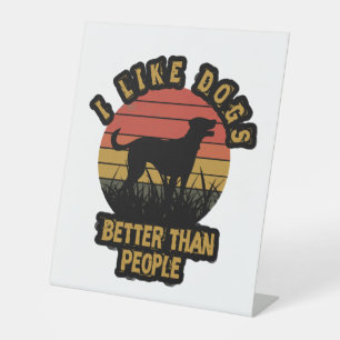 I like dogs better than peple pedestal sign