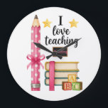 I love teaching reading teacher clock<br><div class="desc">Cute reading teacher design with pencil and books. Perfect for teachers who love helping students learn to read.</div>