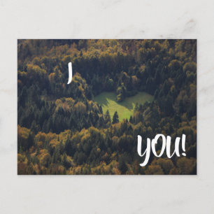 I love you card with heart shape in a forest
