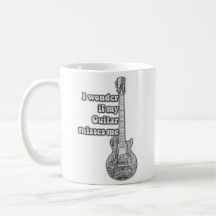 I wonder if my guitar misses me. Black and white Coffee Mug