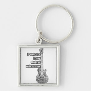 I wonder if my guitar misses me. Black and white Keychain