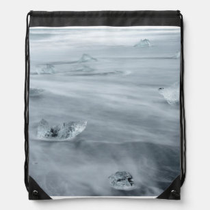 Ice and water on a beach, iceland drawstring bag