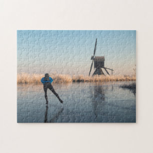 Ice skating past windmill and reeds puzzle