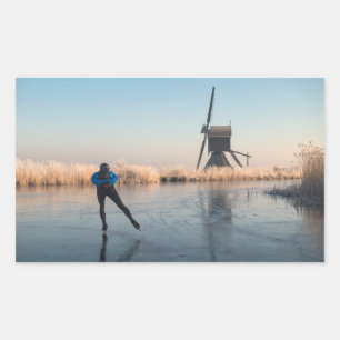 Ice skating past windmill & reed rectangle sticker