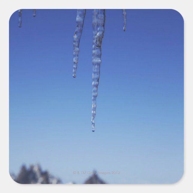 Icicles and snow-covered mountains square sticker (Front)