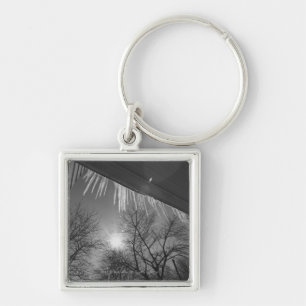 Icicles on roof and sun keychain