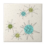 Iconic Atomic Starbursts Small Ceramic Tile<br><div class="desc">This Iconic Atomic Starbursts Small Ceramic Tile pattern features iconic atomic starbursts. That’s right! The old school, cream coloured background with gold speckles is the perfect backdrop for the vibrant turquoise, soothing celery, and kitschy pear green coloured circles. The spots of colour are sporadically placed in various sizes with overlaying...</div>