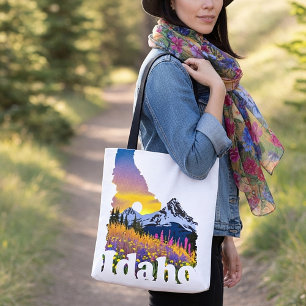Idaho shape with mountain and wildflowers tote bag