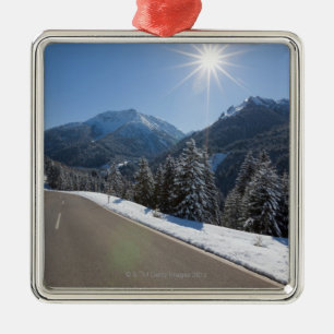 Idyllic empty road thrugh a winter landscape, 2 metal ornament
