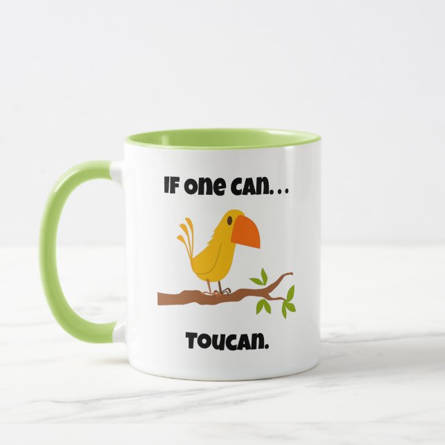 If One Can. . .Toucan, Funny Pun Cartoon Mug (Left)