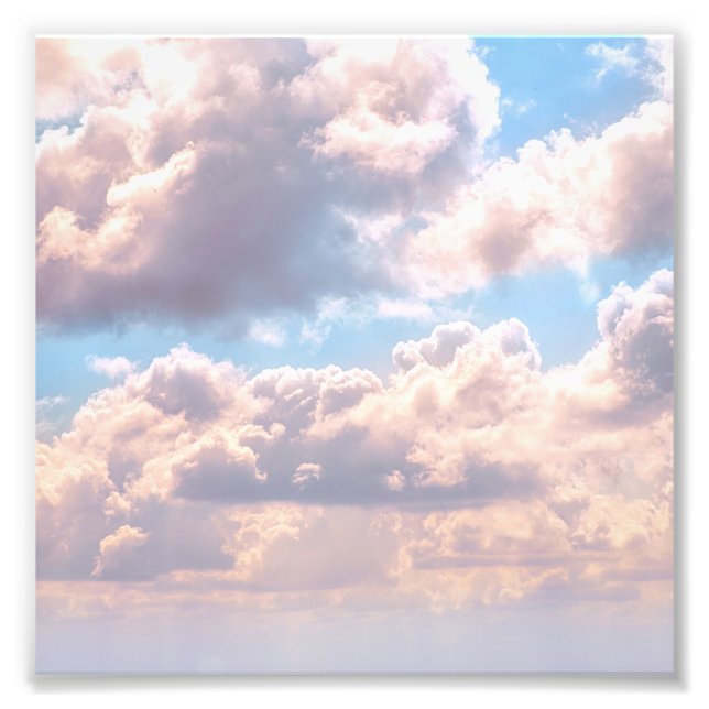 Illuminated pink fluffy clouds in a blue sky photo print (Front)