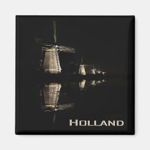 Illuminated windmills at night text magnet