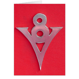 Illusion Chrome V8 Emblem on Red Leather