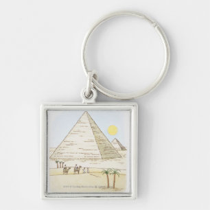 Illustration of pyramids and men with camels keychain