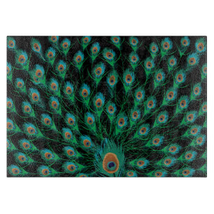 Illustration With Peacock Feathers on Black Cutting Board