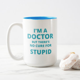 "I'm a DOCTOR but there no cure for STUPID" Funny Two-Tone Coffee Mug