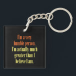 I'm a very humble person keychain<br><div class="desc">Egotistic or Realistic? You be the judge! Reads "I'm a humble person. I'm actually much greater than I think I am." Other colours are available.</div>