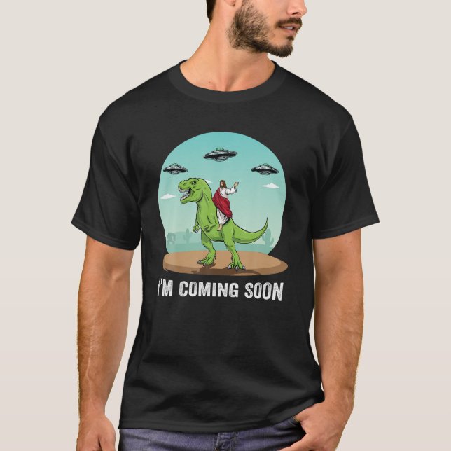 I'm Coming Soon Jesus Riding On A Dinosaur UFO Ali T-Shirt (Front)