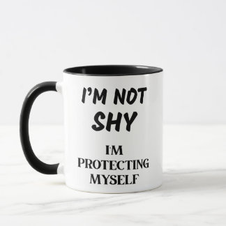 I'M NOT SHY, I'M PROTECTING MYSELF MUG