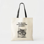 I'm silently correcting your grammar cat tote bag<br><div class="desc">I'm silently correcting your grammar teacher tote bag. Funny animal print design with humourous quote. Cute idea for english teacher and school class room. The grammar police is here! Geek fun / teaching humour. Nerdy cat / kitten with glasses.</div>