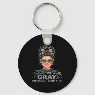 In april wear grey parkinson's awareness messy bun keychain