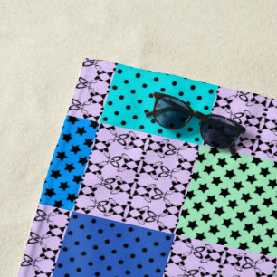 In dark multi-coloured tones, retro geometric beach towel