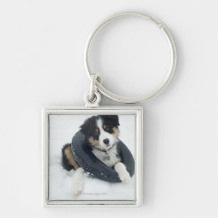 in inner tube in the snow keychain