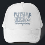 In My Engaged Era Engagement Gift Custom Fiance Trucker Hat<br><div class="desc">Elevate your engagement celebration with our "In My Engaged Era" Custom Fiance Trucker Hat. This trendy and cool accessory is the perfect personalized gift for the bride-to-be, adding a touch of retro style to her bridal shower or bachelorette party. The hat features wavy retro text, creating a unique and fashionable...</div>