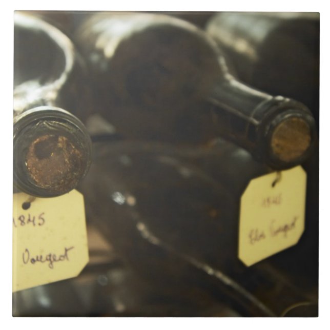 In the underground wine cellar: lying bottles in tile (Front)