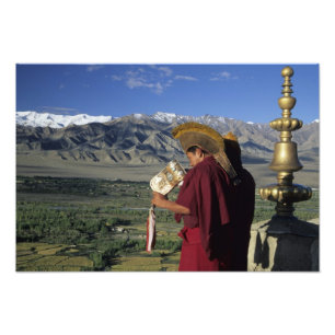 India, Ladakh, Thikse. Buddhist monk blows Photo Print