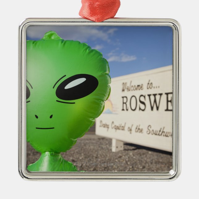 Inflatable alien with Welcome to Roswell sign in Metal Ornament (Front)