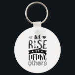 Inspirational Kind Quote We Rise By Lifting Others Keychain<br><div class="desc">Inspirational motivation quote to keep you inspired and motivate others around you.

Beautiful saying about being kind and supporting each other. We rise by lifting others.

Background colour can be customized to your desired colour.</div>