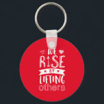 Inspirational Quote We Rise By Lifting Others Keychain<br><div class="desc">Inspirational motivation quote to keep you inspired and motivate others around you.

Beautiful saying about being kind,  supportive and helping each other. We rise by lifting others.

Background colour can be customized to your desired colour.</div>