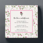 Inspirational Quote With Wildflower Pattern Plaque<br><div class="desc">An inspirational quote which says: Be like a wildflower. Strong enough to rise up when trampled upon. Tough enough to weather the worst storms. Able to flourish in the most broken places. With a pink and green wildflower pattern as a backdrop. The quote is placed inside an eggshell white frame...</div>