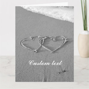 Interlocking hearts in beach sand greeting cards