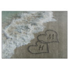 Interlocking Hearts on Beach Sand
