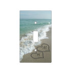 Interlocking Hearts on Beach Sand
