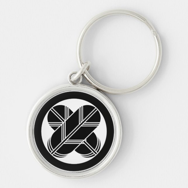 Intersecting hawk feathers in a circle keychain (Front)