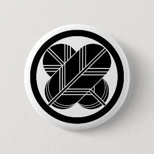 Intersecting hawk feathers with foot in circle 2 inch round button