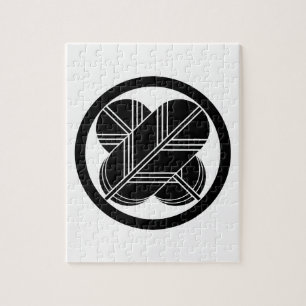 Intersecting hawk feathers with foot in circle jigsaw puzzle