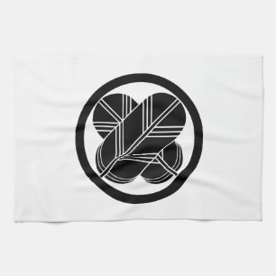 Intersecting hawk feathers with foot in circle kitchen towel
