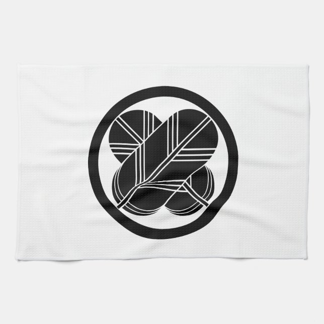 Intersecting hawk feathers with foot in circle kitchen towel (Horizontal)