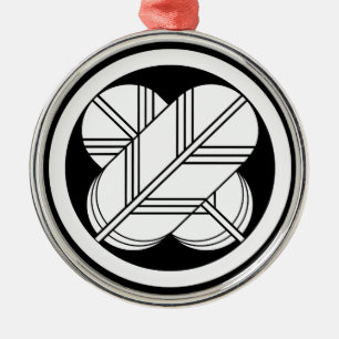 Intersecting hawk feathers with foot in circle metal ornament